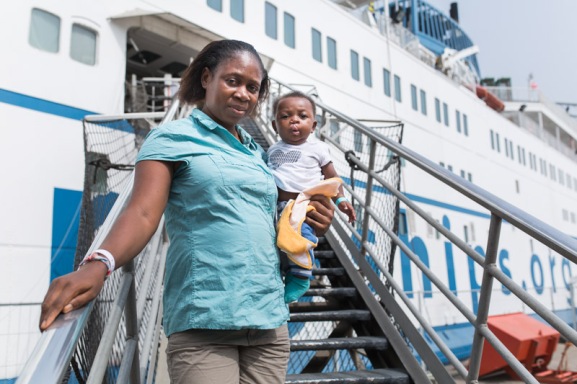 Paul Pascal with his mother on the gangway after going through the Infant Feeding Program and having his cleft lip repaired.