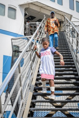Ortho patient Justine walking down the gangway to go home